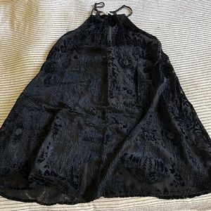 Sleeveless black dress with velvet pattern, size small.